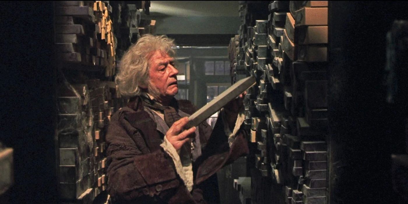 Ollivander pulling out a wand in Ollivanders in Harry Potter.