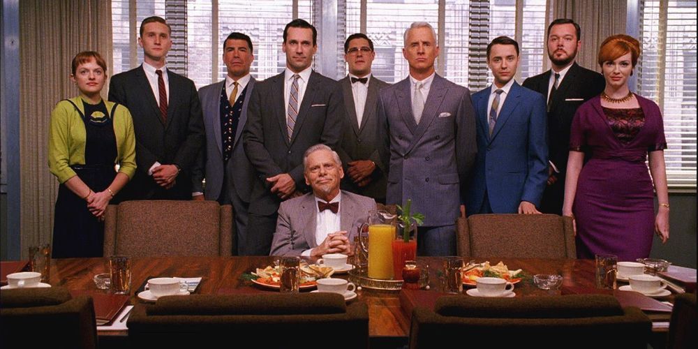 The original cast of Mad Men pose in Sterling Cooper offices