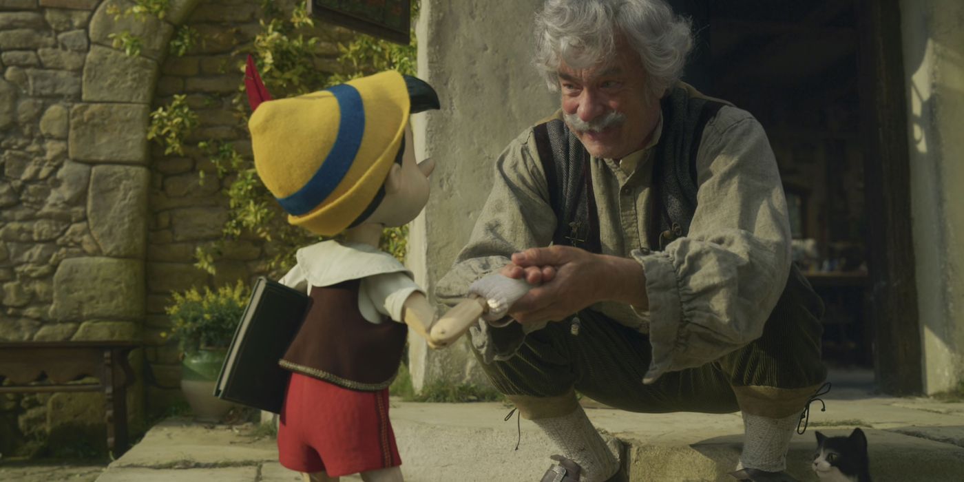 An image of Geppetto talking to Pinocchio in the 2022 remake