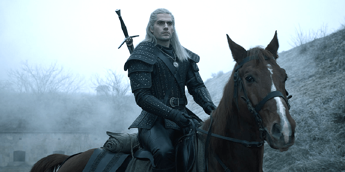 Henry Cavill as Geralt of Rivia rides Roach on the set of The Witcher on Netflix