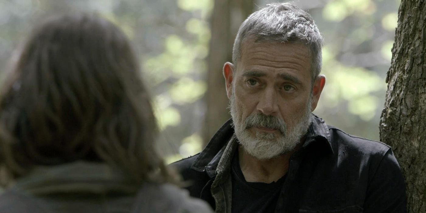 Negan with white hair and a white beard looking at Maggie in a scene from The Walking Dead.