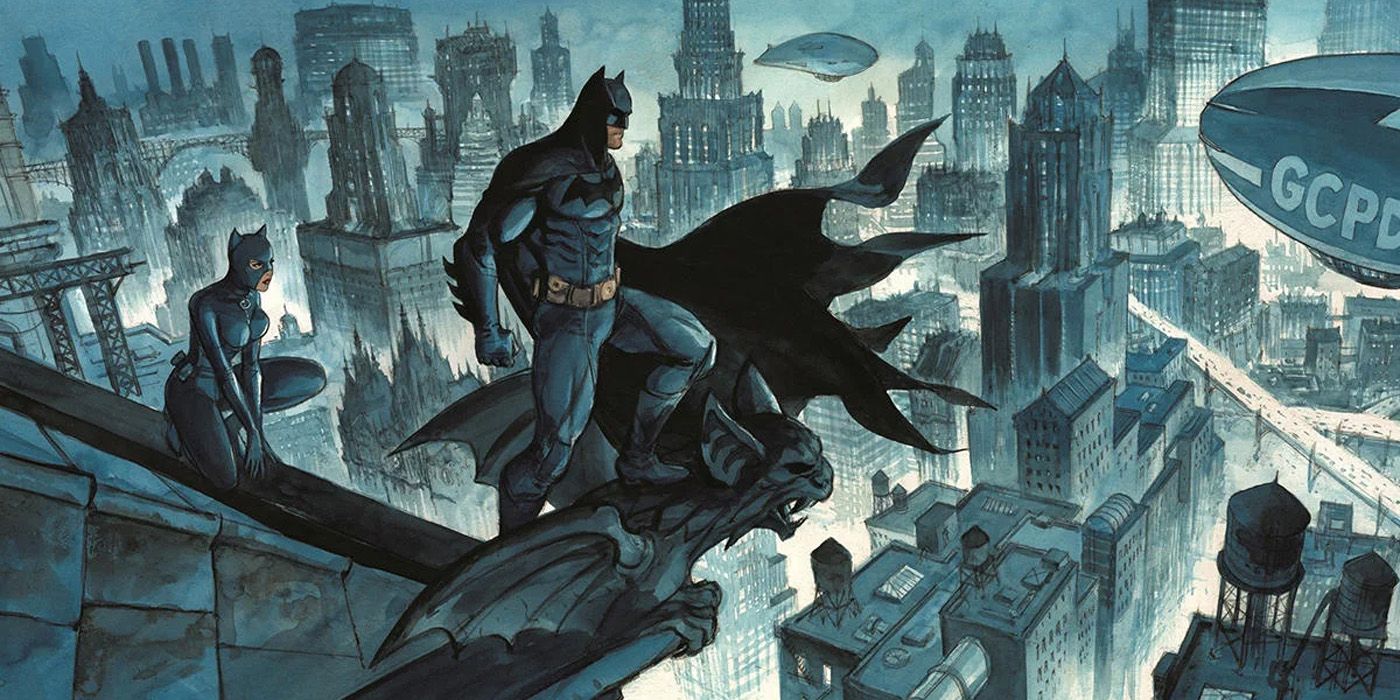 Batman and Catwoman look over Gotham City