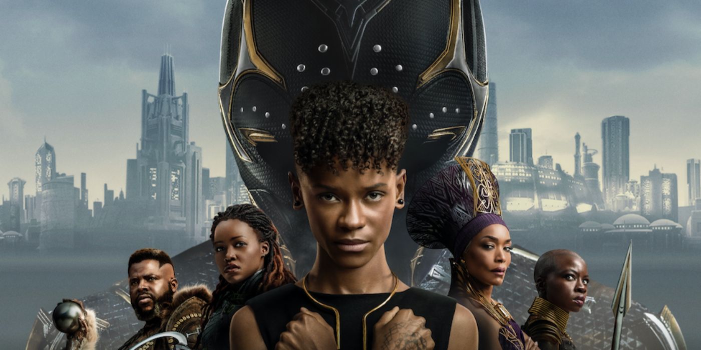 The cast of Black Panther: Wakanda Forever, with Shuri centered, poses before a skyline and the Black Panther mask