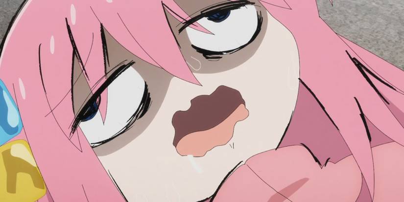 Bocchi drooling and suffering on the ground in Bocchi the Rock!