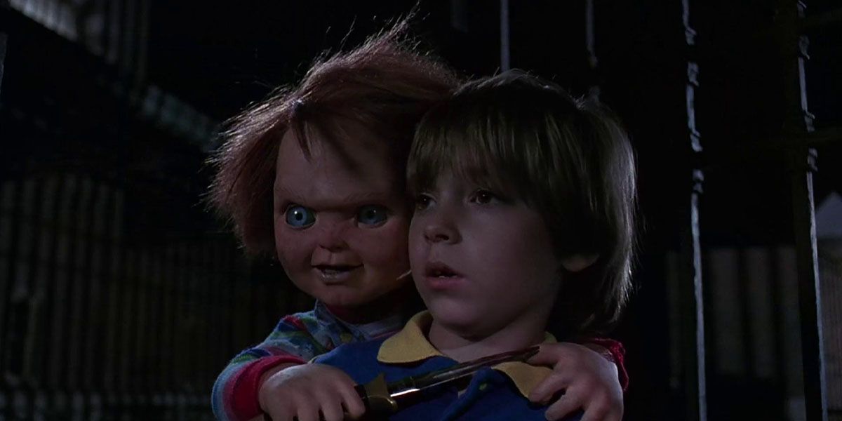 Chucky holds a knife to Andy Barclay In Child's Play 2