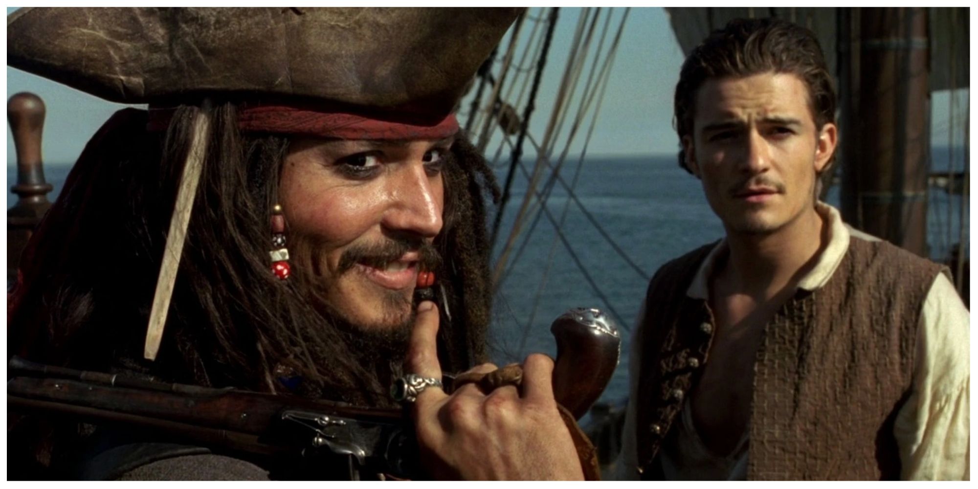 Johnny Depp as Jack Sparrow and Orlando Bloom as Will Turner in Pirates of the Carribean: Curse of the black pearl