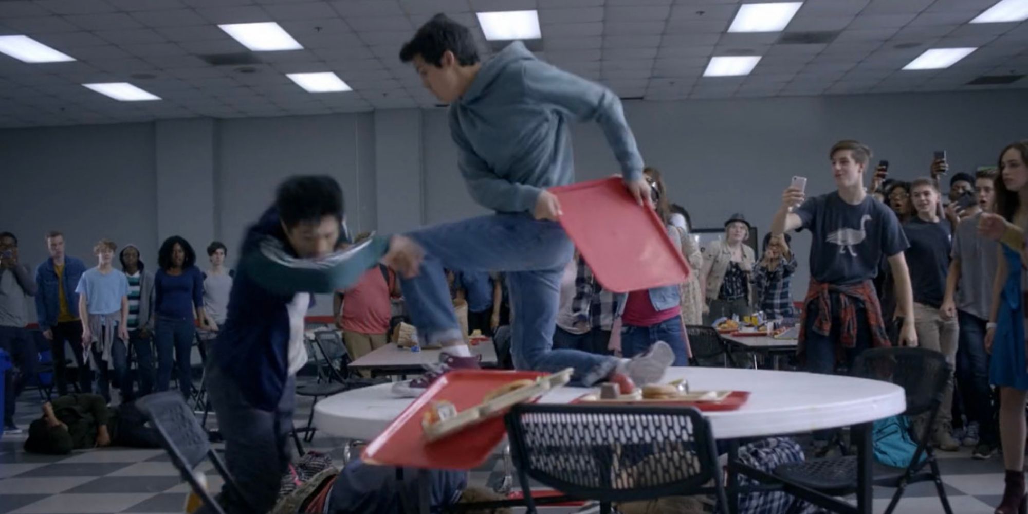 Cobra Kai's Miguel Diaz defeats his bully in a fight using a lunch tray