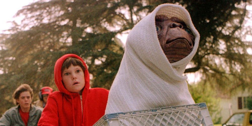 E.T. and Elliott on a bike trying to get home