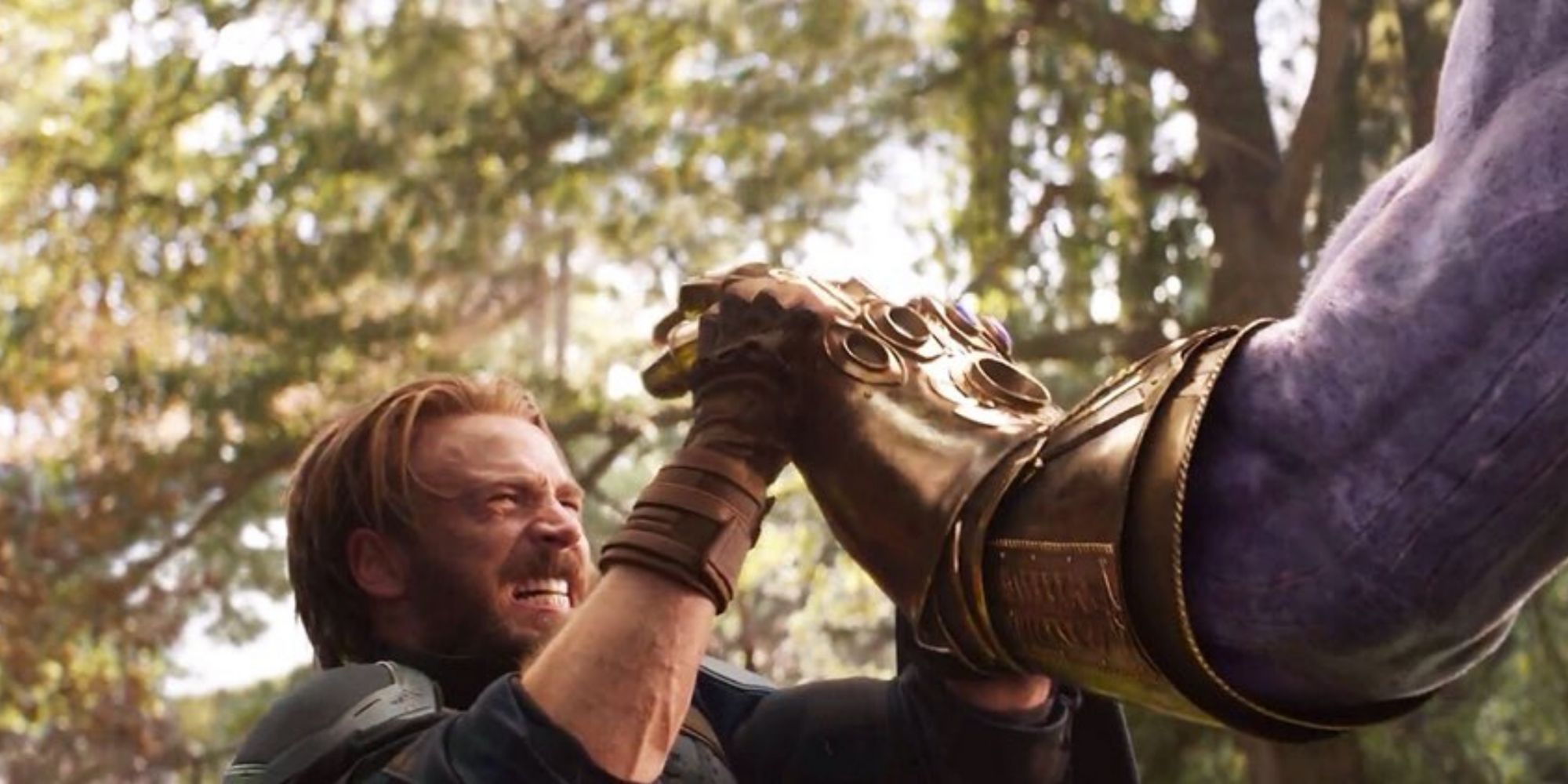 Captain America holding back Thanos' fist in Avengers: Infinity War