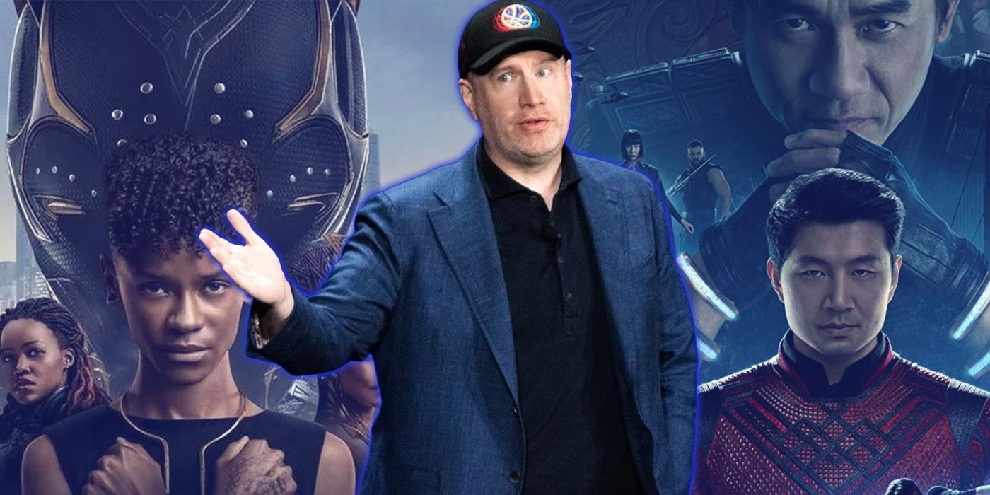 Kevin Feige with Black Panther Wakanda Forever and Shang-Chi poster behind him