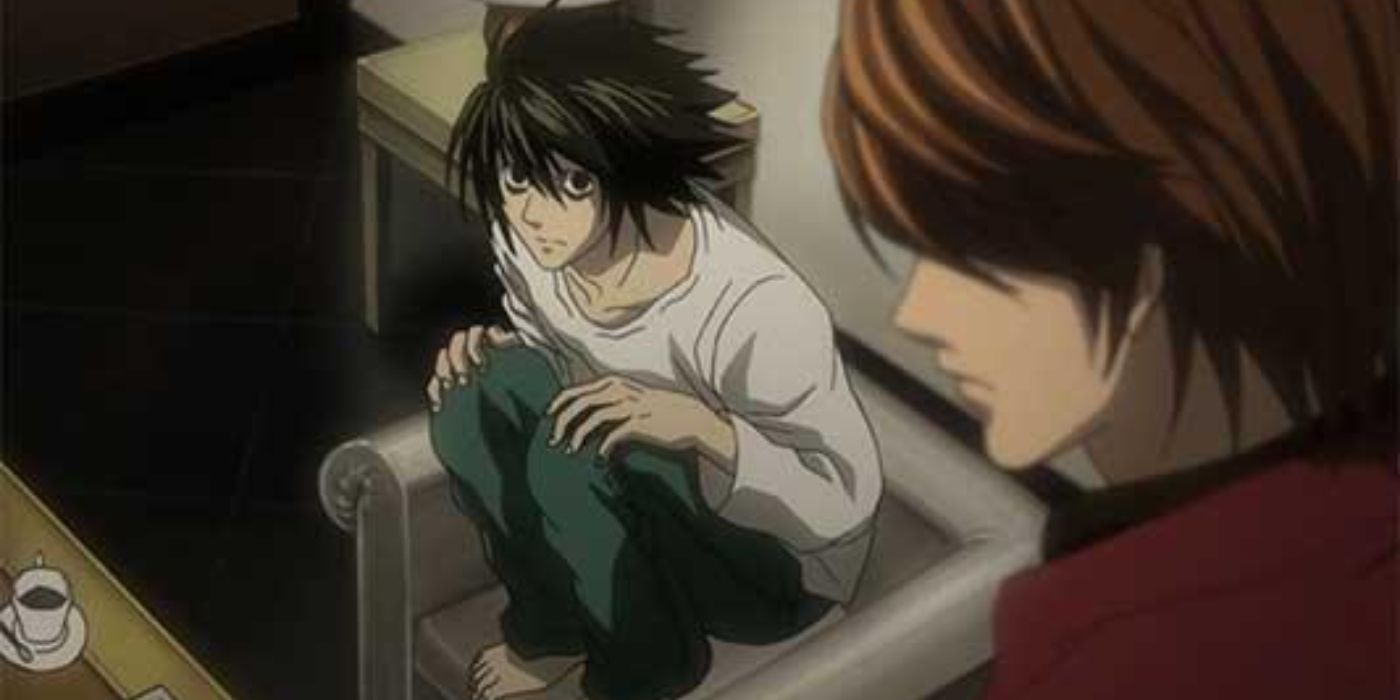 L from Death Note crouched on a chair.