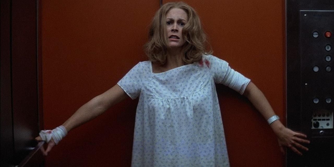 Laurie Strode, played by Jamie Lee Curtis, stands terrified in a hospital elevator in Halloween II