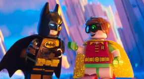 Batman and Dick Grayson/Robin smiling and laughing in the Lego Batman Movie