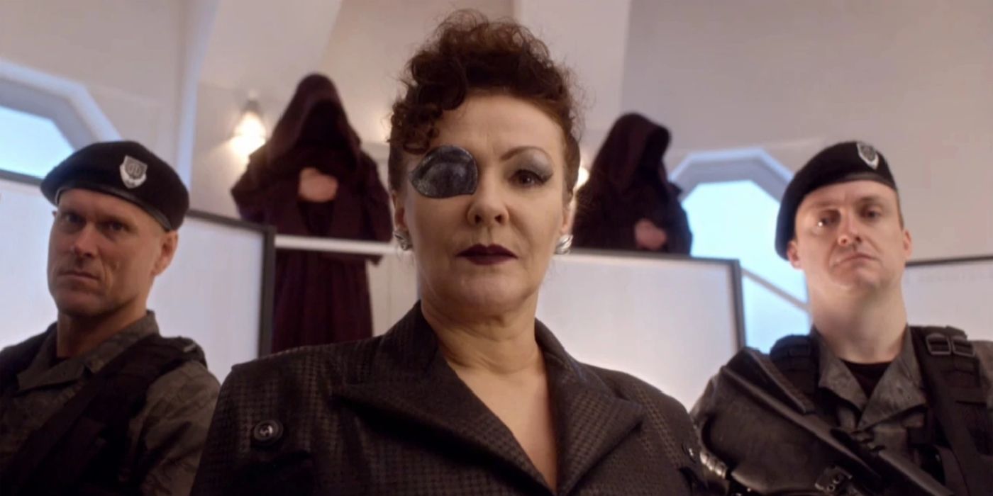 Madame Kovarian from Doctor Who flanked by two soldiers