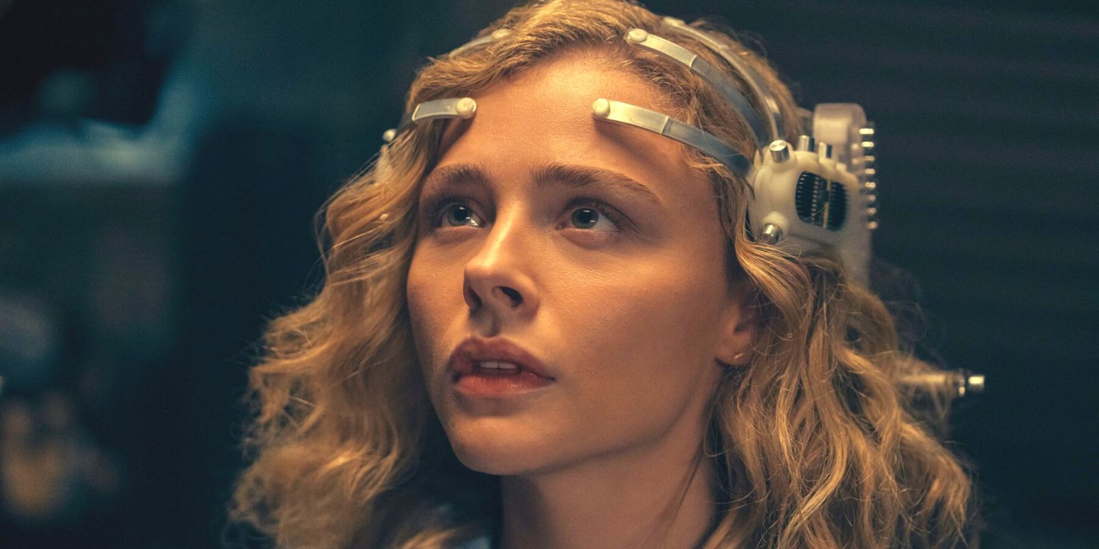 Chloe Grace Mortez with a sci-fi headpiece in The Peripheral