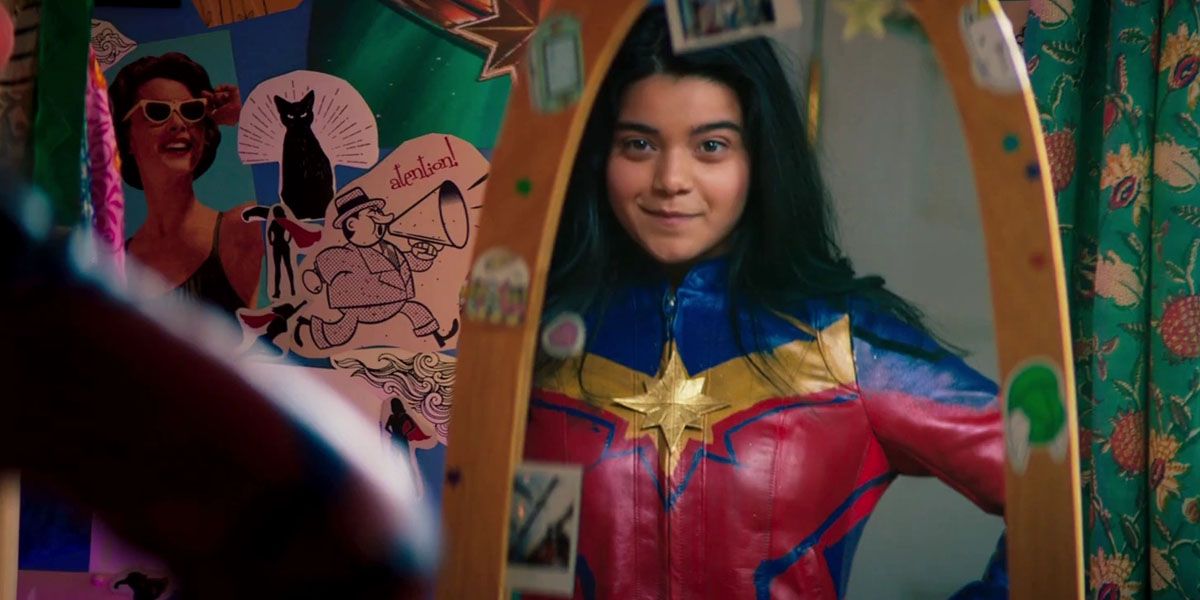 Kamala Ms.  Marvel looking at herself in the mirror with her Ms. cosplay.  Marvel.