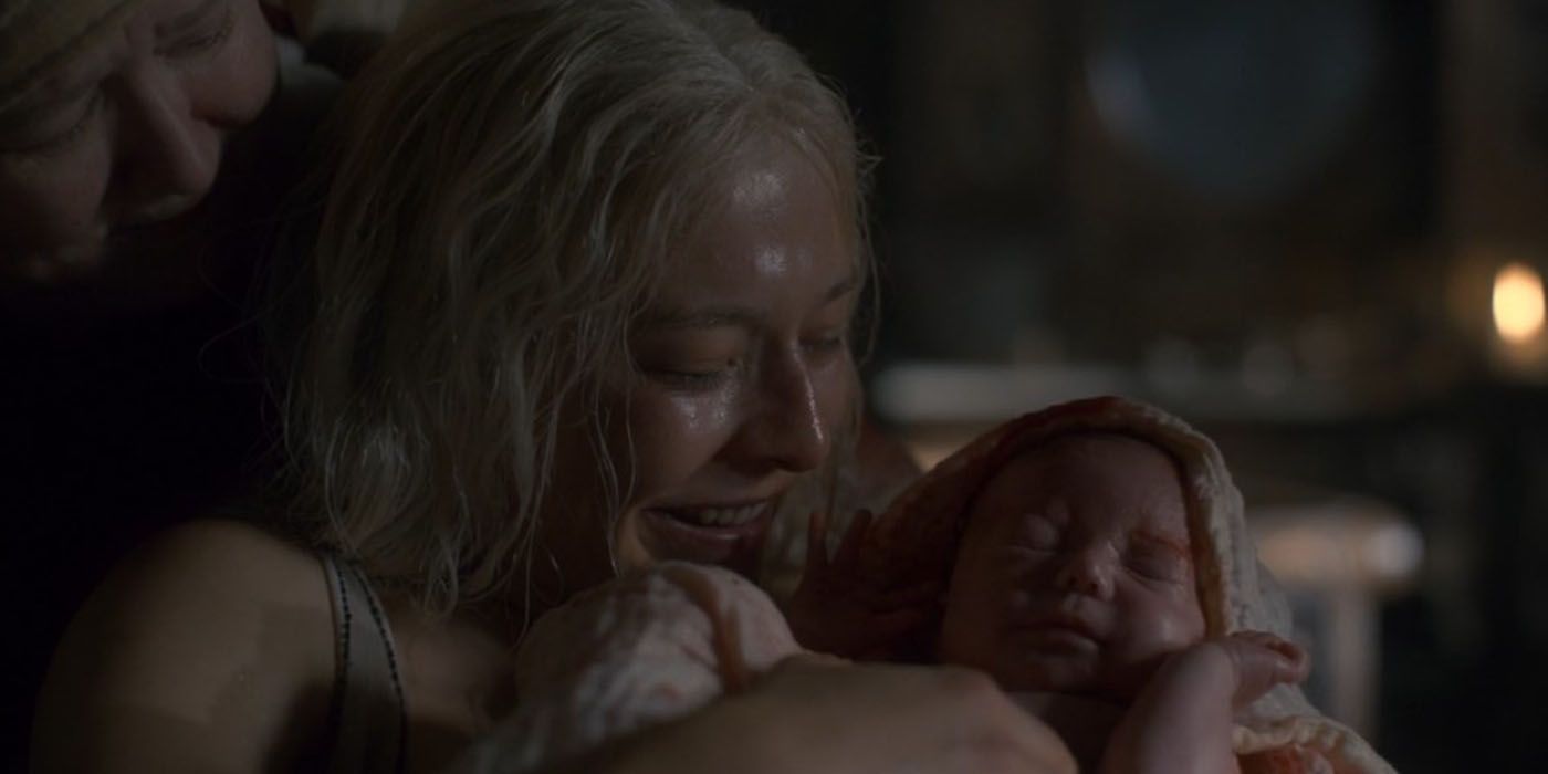 Rhaenyra Targaryen (Emma D'Arcy) holds baby Joffrey after birth on House of the Dragon