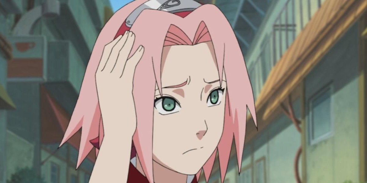 Sakura Haruno holds her hair and looks concerned in Naruto Shippuden.