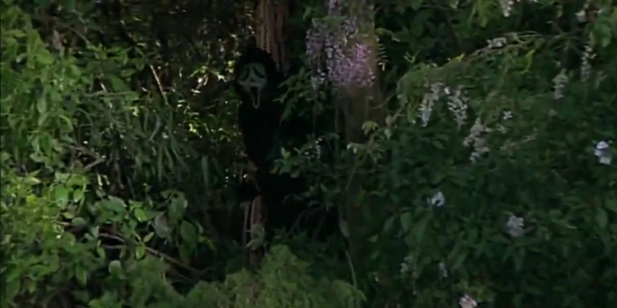 Scream's Ghostface lurking in the bushes