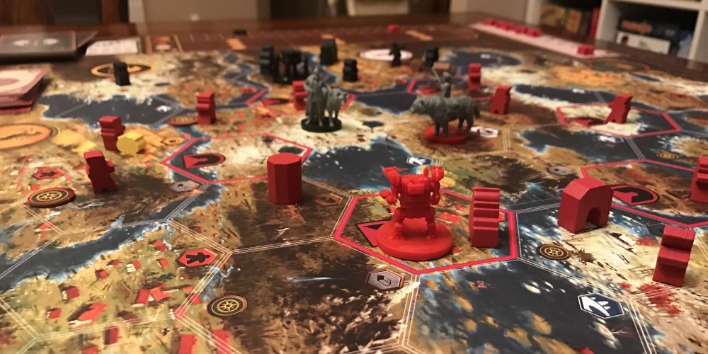 A mech facing off with other units in Scythe game.