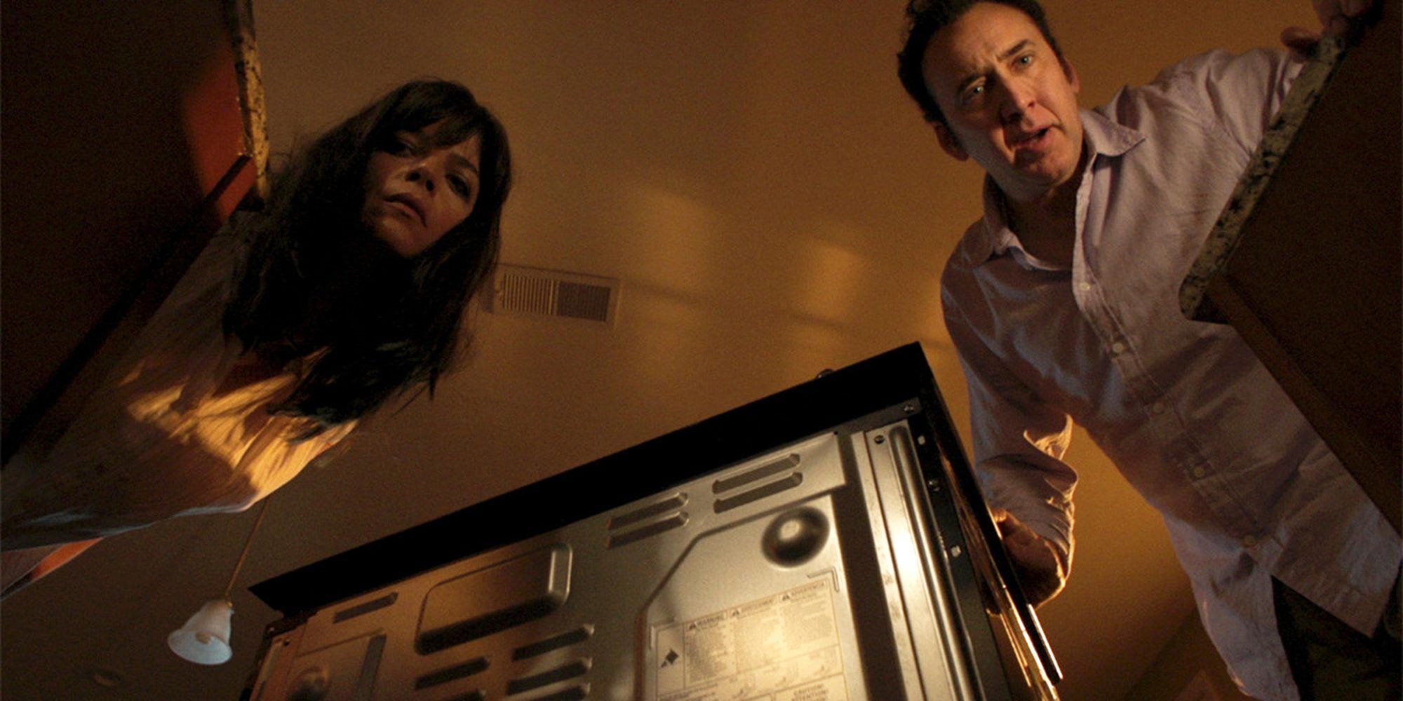 Selma Blair and Nic Cage in Mom and Dad