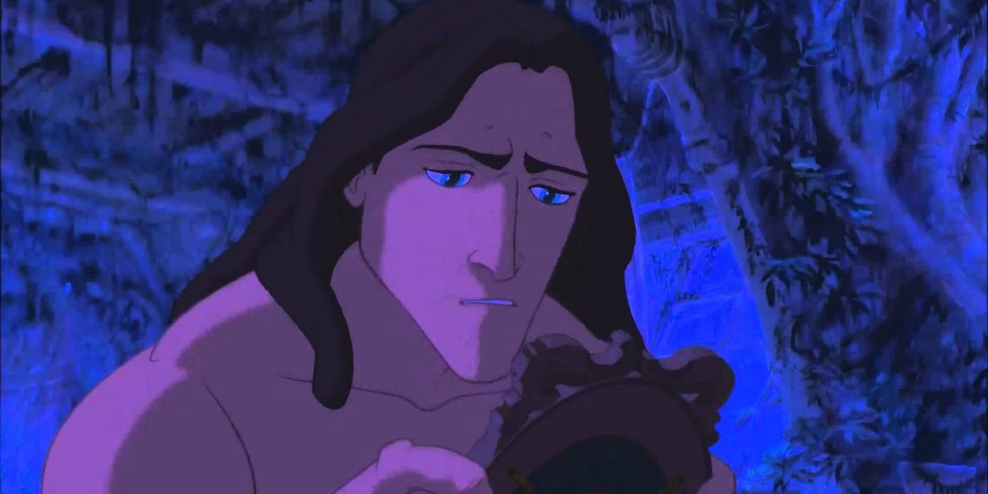 Tarzan from Tarzan (1999) looking at an old photo of his family