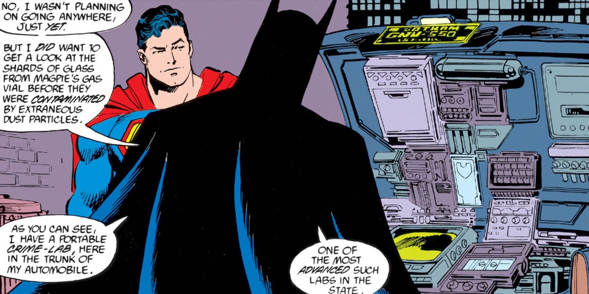 Batman shows Superman the portable crime-lab in the Batmobile in DC.