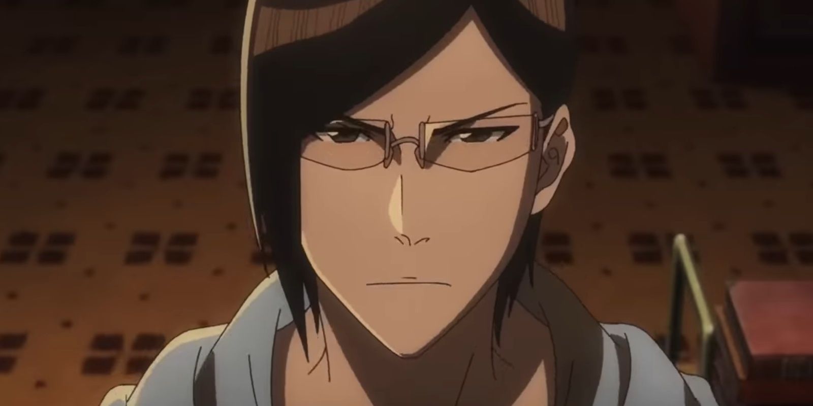 Uryu Ishida in the new Bleach anime wearing glasses and frowning.