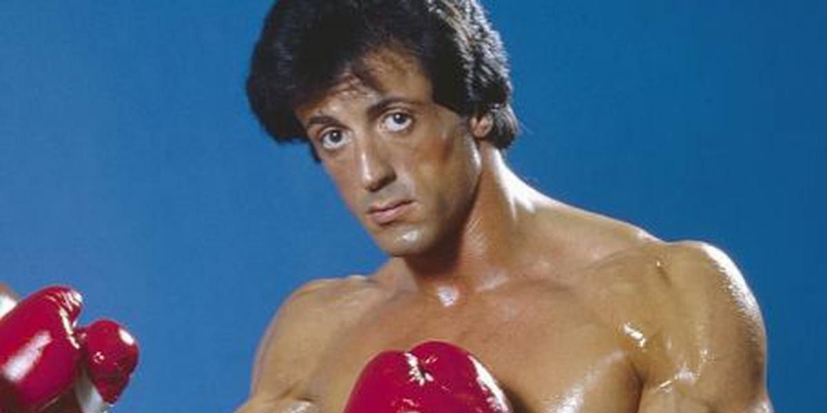 Rocky poses with red gloves from Rocky III