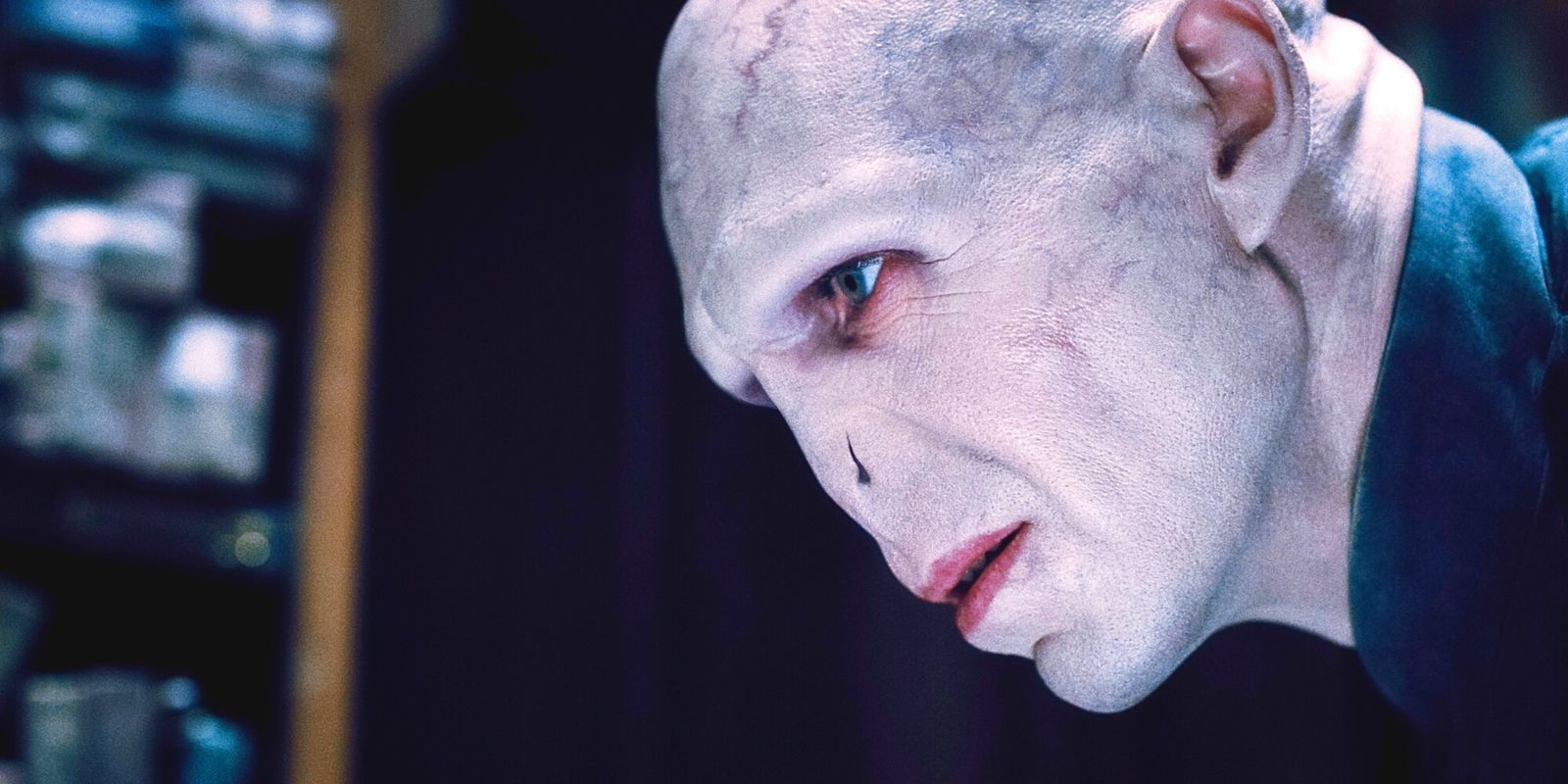 Ralph Fiennes as Voldemort looking intently in Harry Potter.