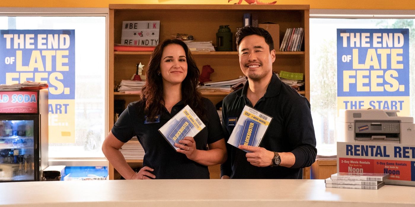 Eliza and Timmy holding DVDs while smiling in Blockbuster TV show 