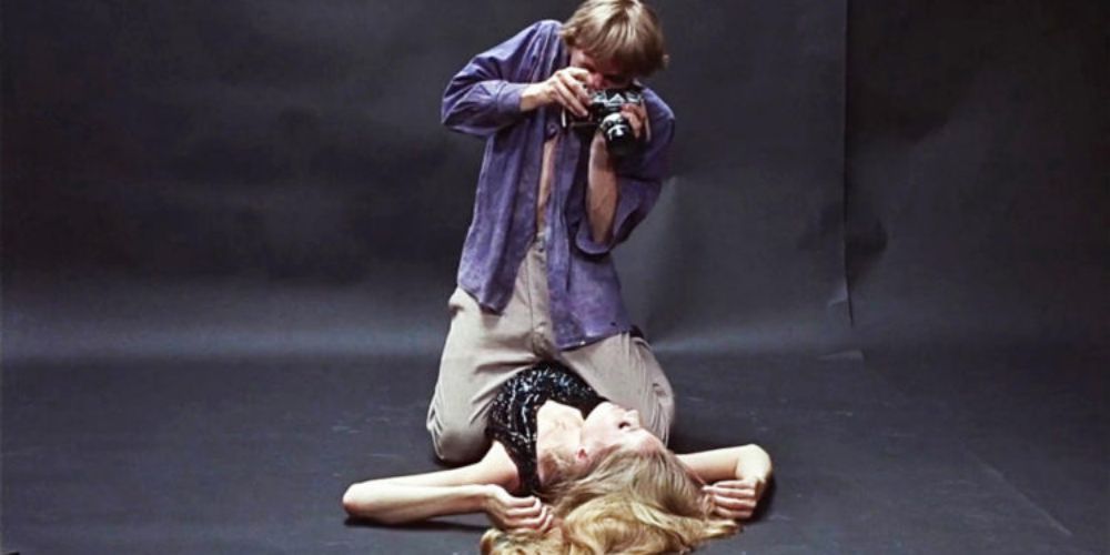 Thomas photographing a model in blow up