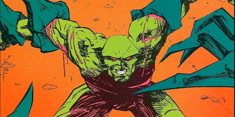 Alien hands grabbing a bloody Martian Manhunter in DC Comics