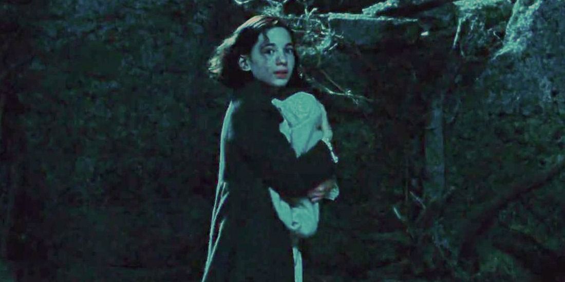 Ofelia holds her baby brother - Pan's Labyrinth