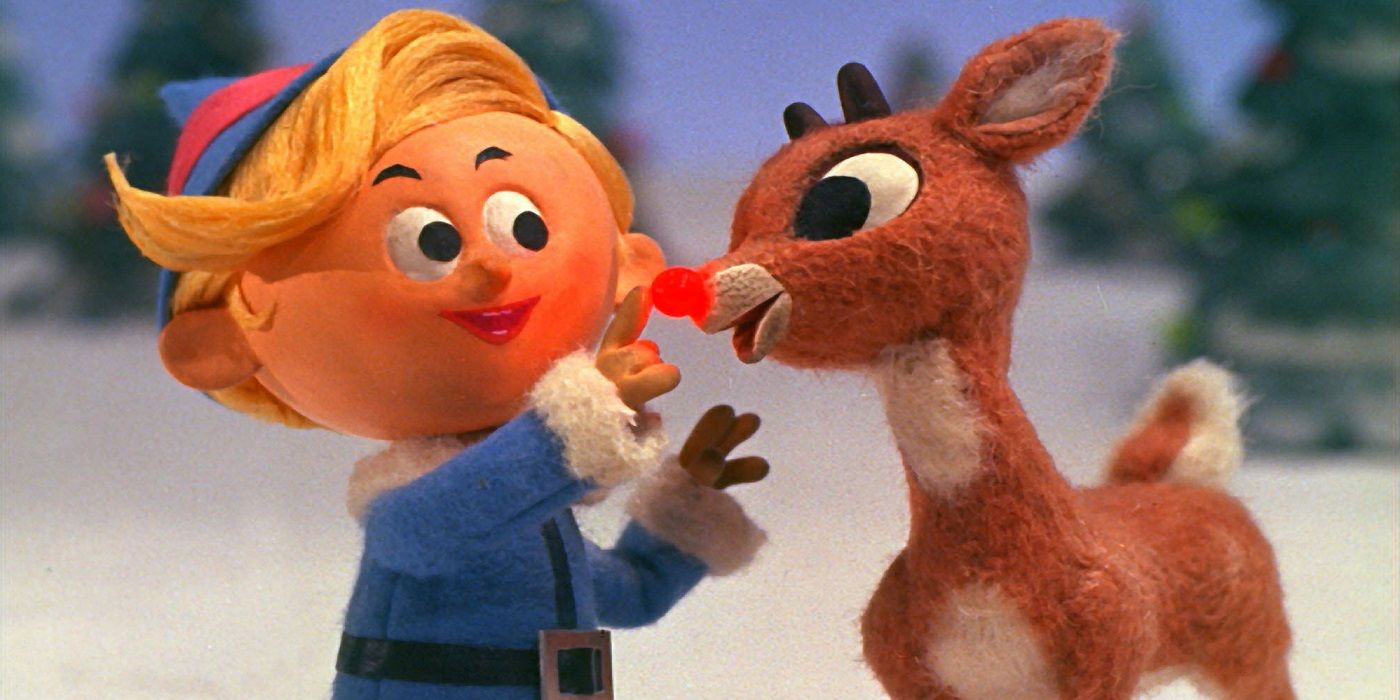 Hermey touching Rudolph's glowing red nose