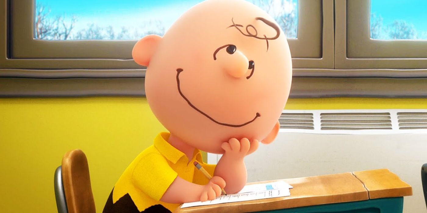 Charlie Brown dreaming at his desk