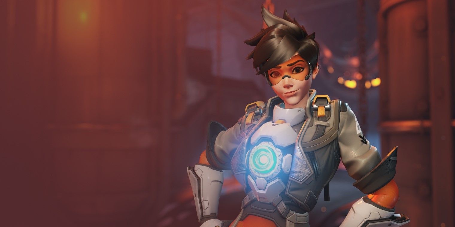 Tracer gives a casual grin in cover art for Overwatch 2