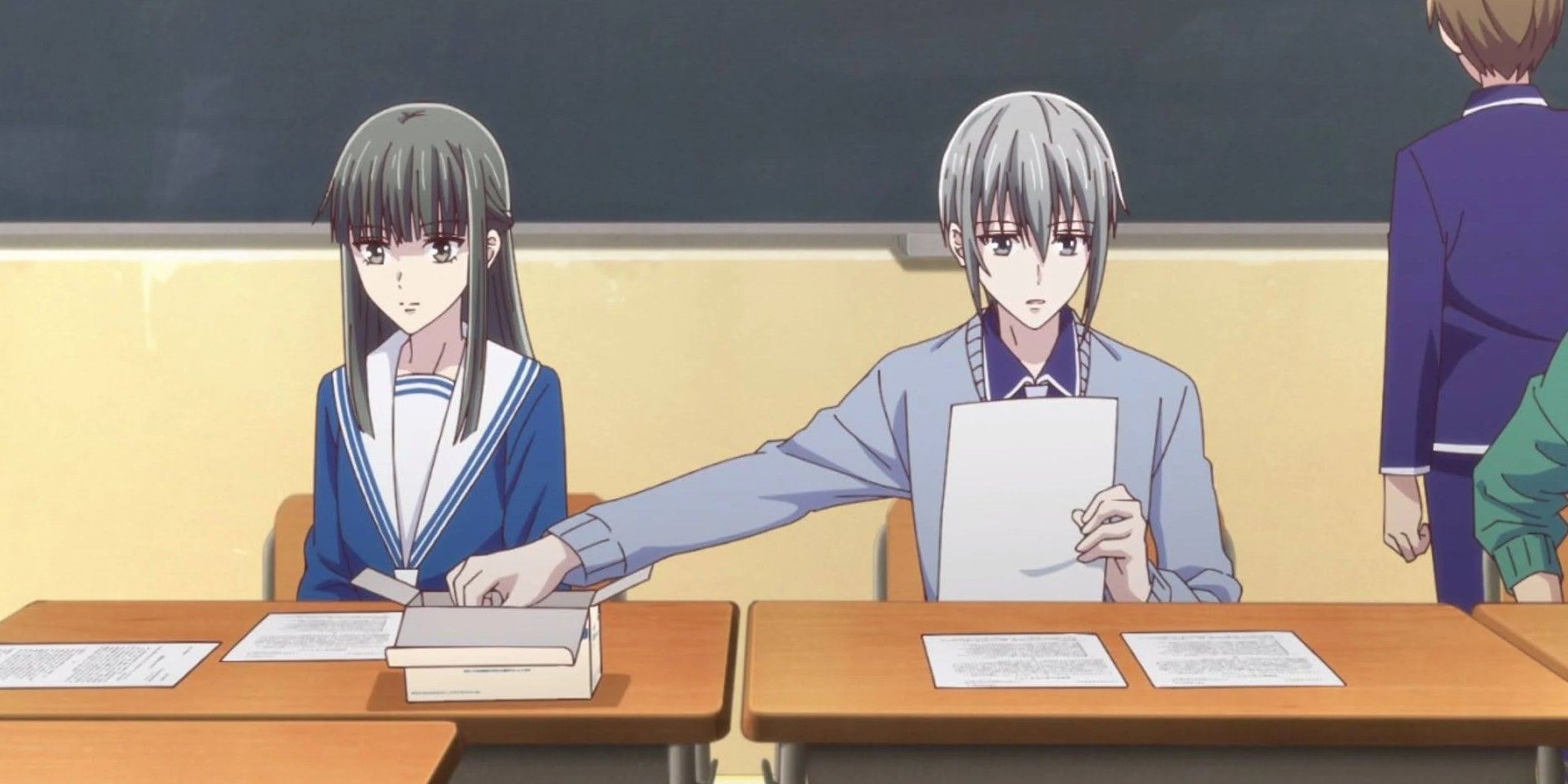 Yuki reaching for chalk in front of Machi in Fruits Basket.