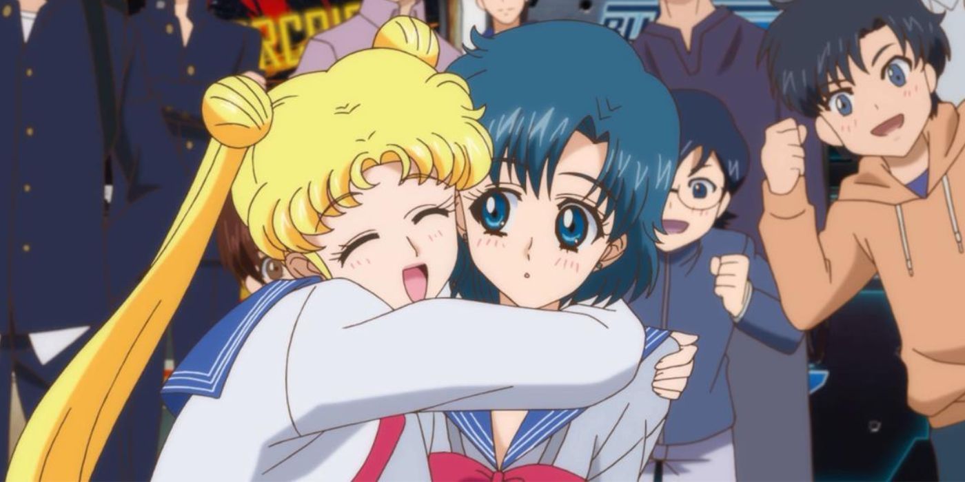 Usagi hugging Ami in front of a crowd in Sailor Moon Crystal.