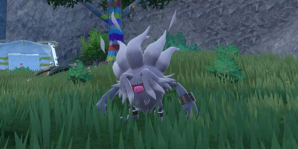 Un Annihilape sauvage dans l'herbe dans Pokémon Scarlet & Violet.