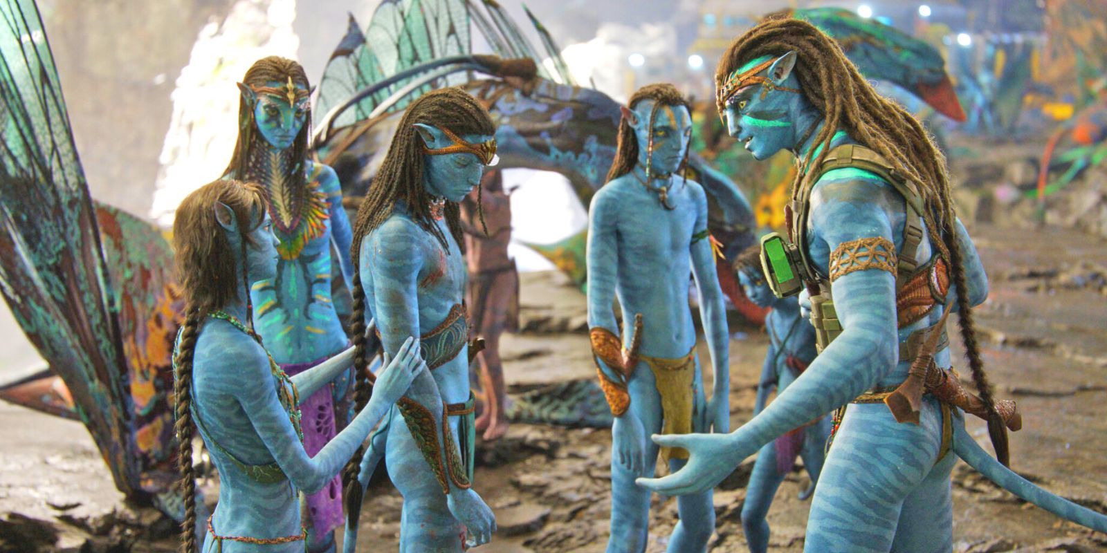 A group of Na'vi comfort a crestfallen ally in Avatar: The Way of Water