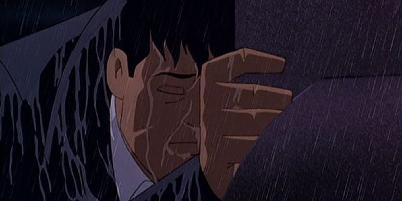 Bruce Wayne at his parents' grave in the rain from Mask of the Phantasm