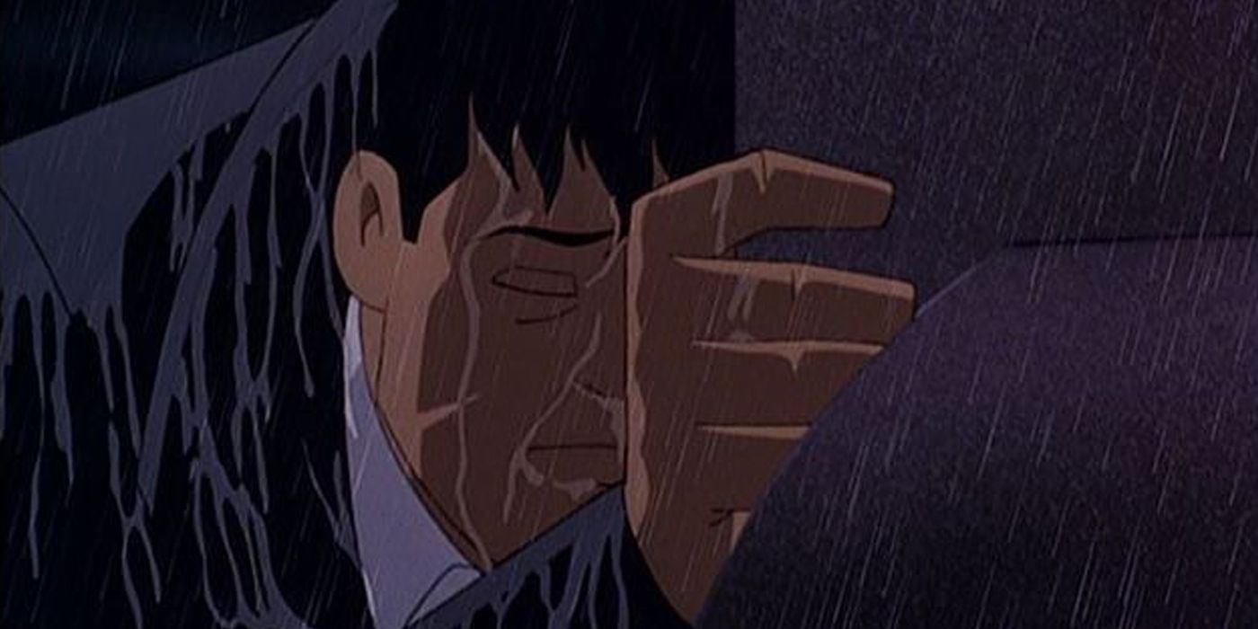 Bruce Wayne at his parents graves in the rain from Mask of the Phantasm