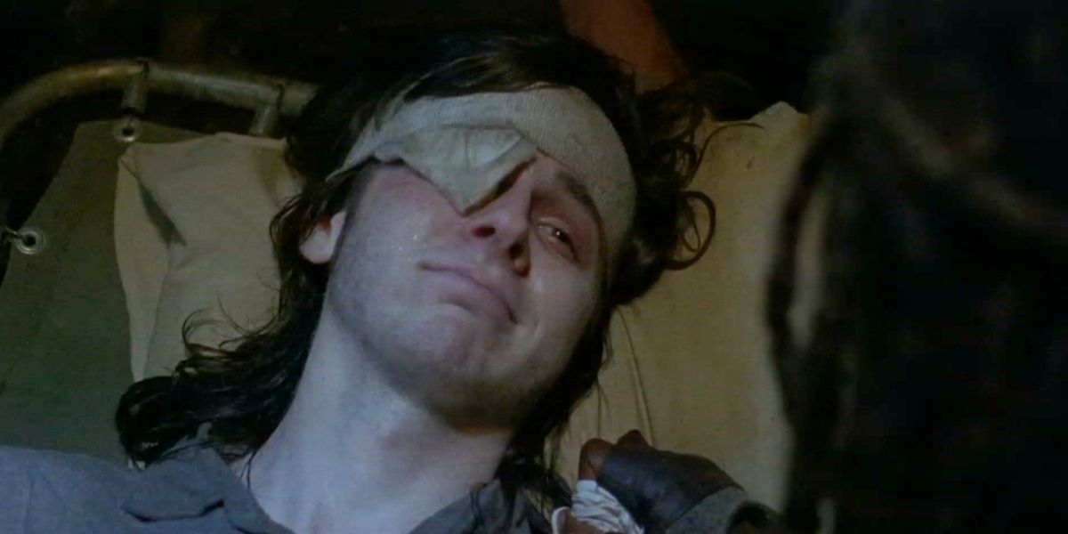 Carl Grimes dying of a walker bite in The Walking Dead.