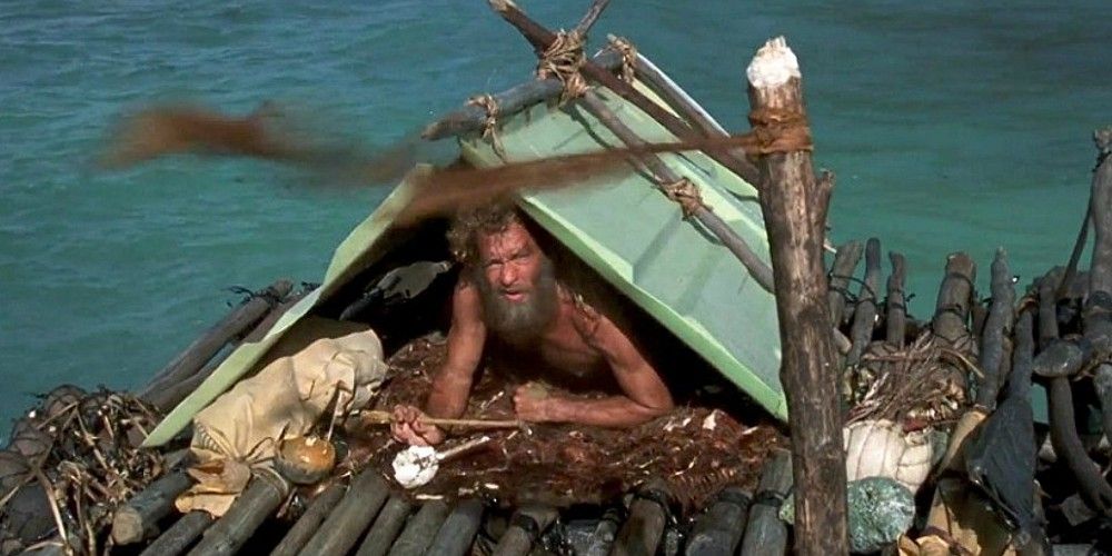 Chuck and Wilson are sitting on the raft in Cast Away