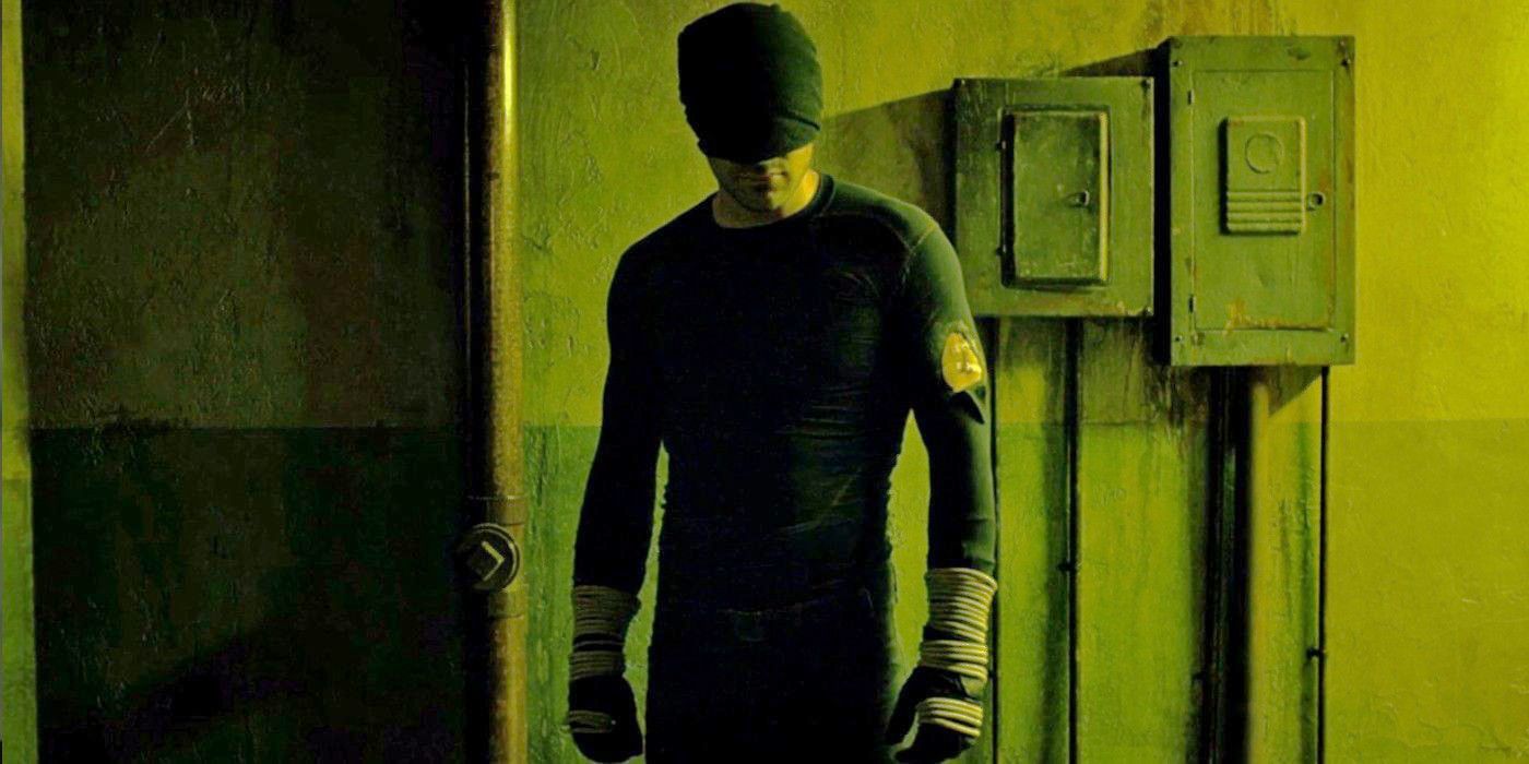 Daredevil in original costume standing in hallway with yellow lighting