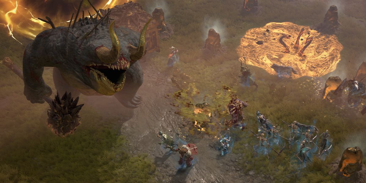 A group of players fight a large enemy in Diablo IV