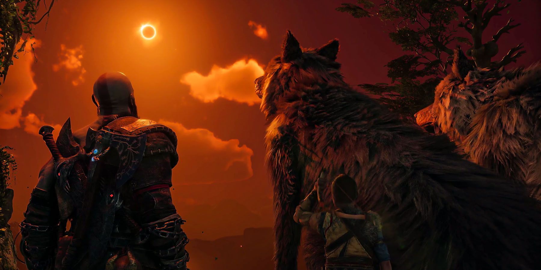 Kratos, Atreus, and wolves look upon an Eclipse in God of War Ragnarok