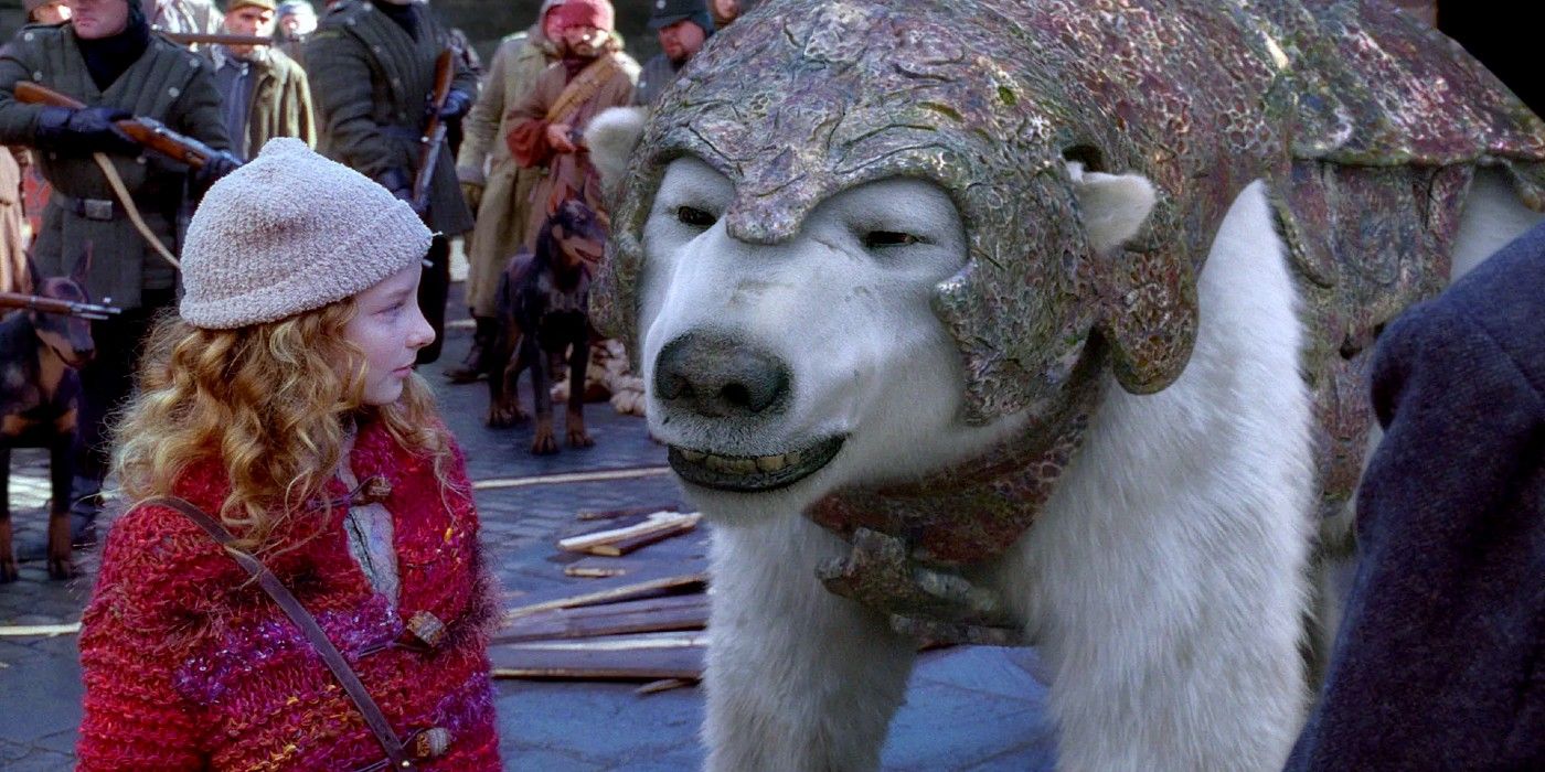 Lyra and Iorek from The Golden Compass look at each other