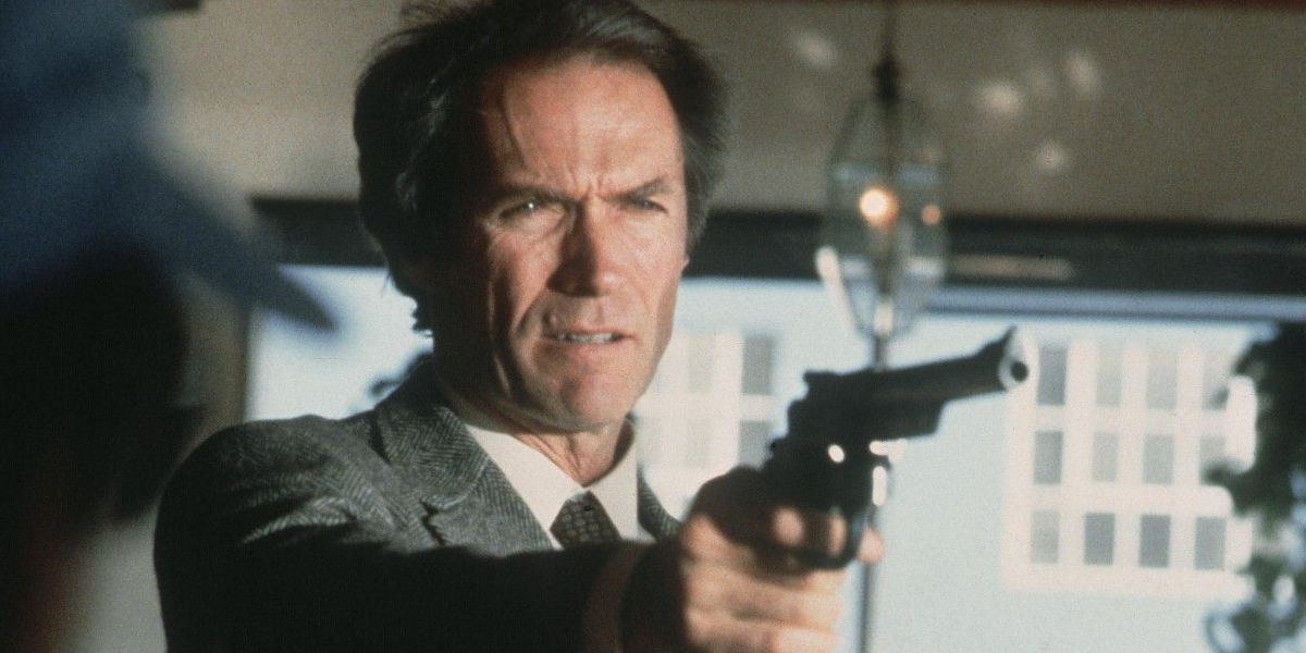 Clint Eastwood as Dirty Harry holding a gun angled towards the right side of the screen.